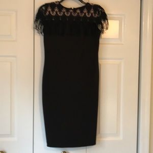 Taylor sleeveless black dress with fringe